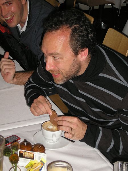 Wikipedia co-founder Jimmy Wales attempting a Tim Tam Slam in Sydney, Australia on 25 April 2007. (Wikipedia)