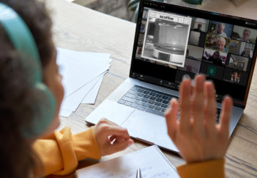 hispanic teen girl distance learning with online teacher on laptop screen.