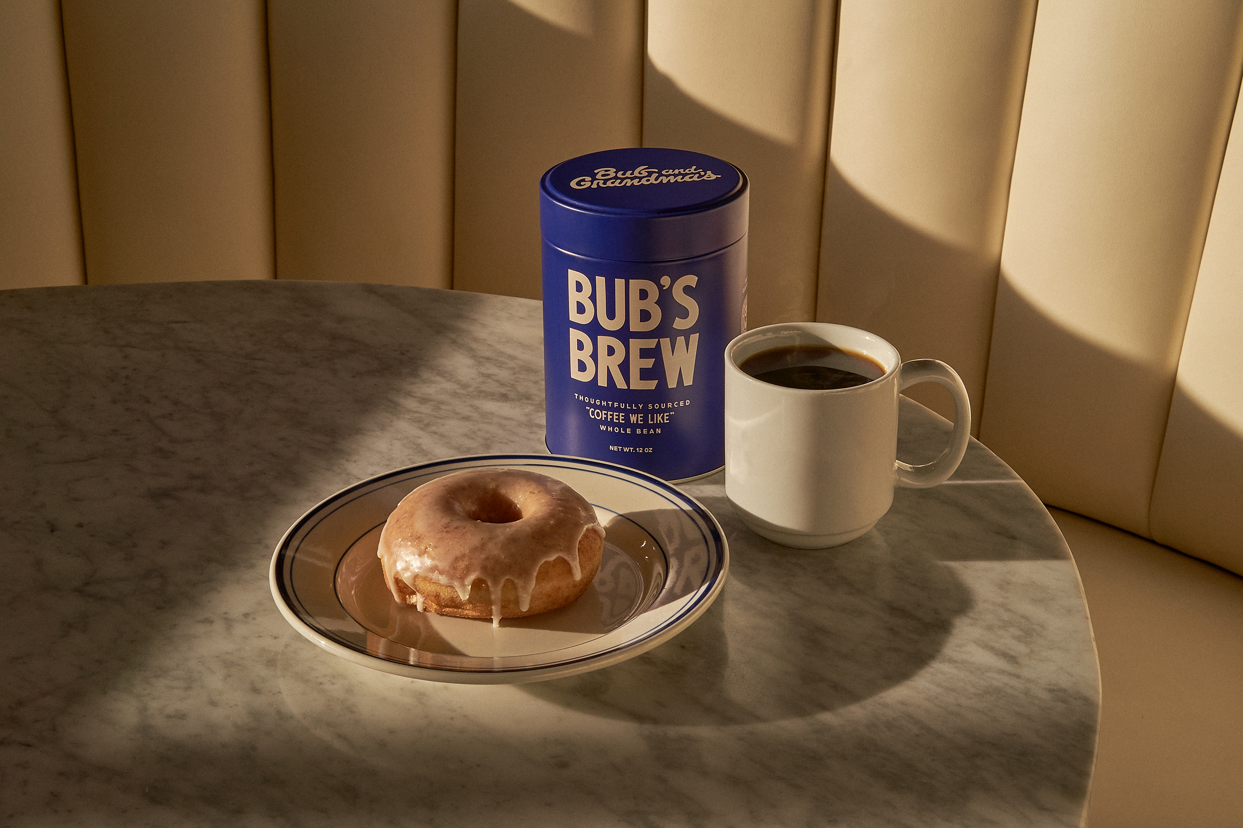 bub's brew coffee packaging lifestyle composition with mug of coffee and bagel