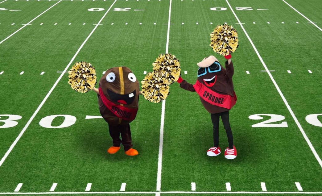 buzzy and spesh cheerleading on football field