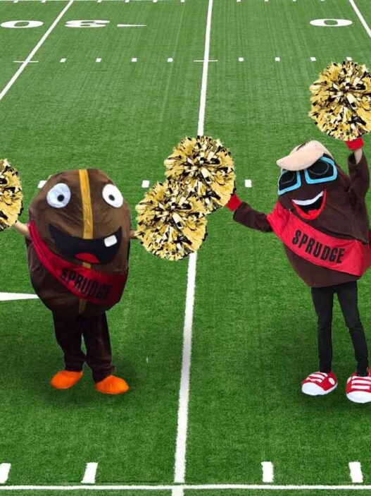 buzzy and spesh cheerleading on football field