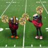 buzzy and spesh cheerleading on football field