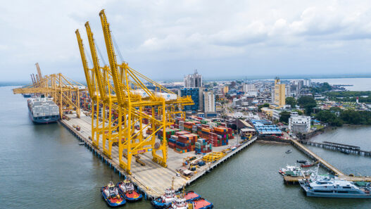 buenaventura industrial port aerial view with yellow cargo crane
