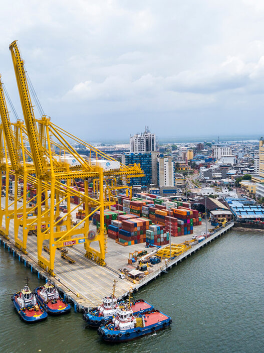buenaventura industrial port aerial view with yellow cargo crane